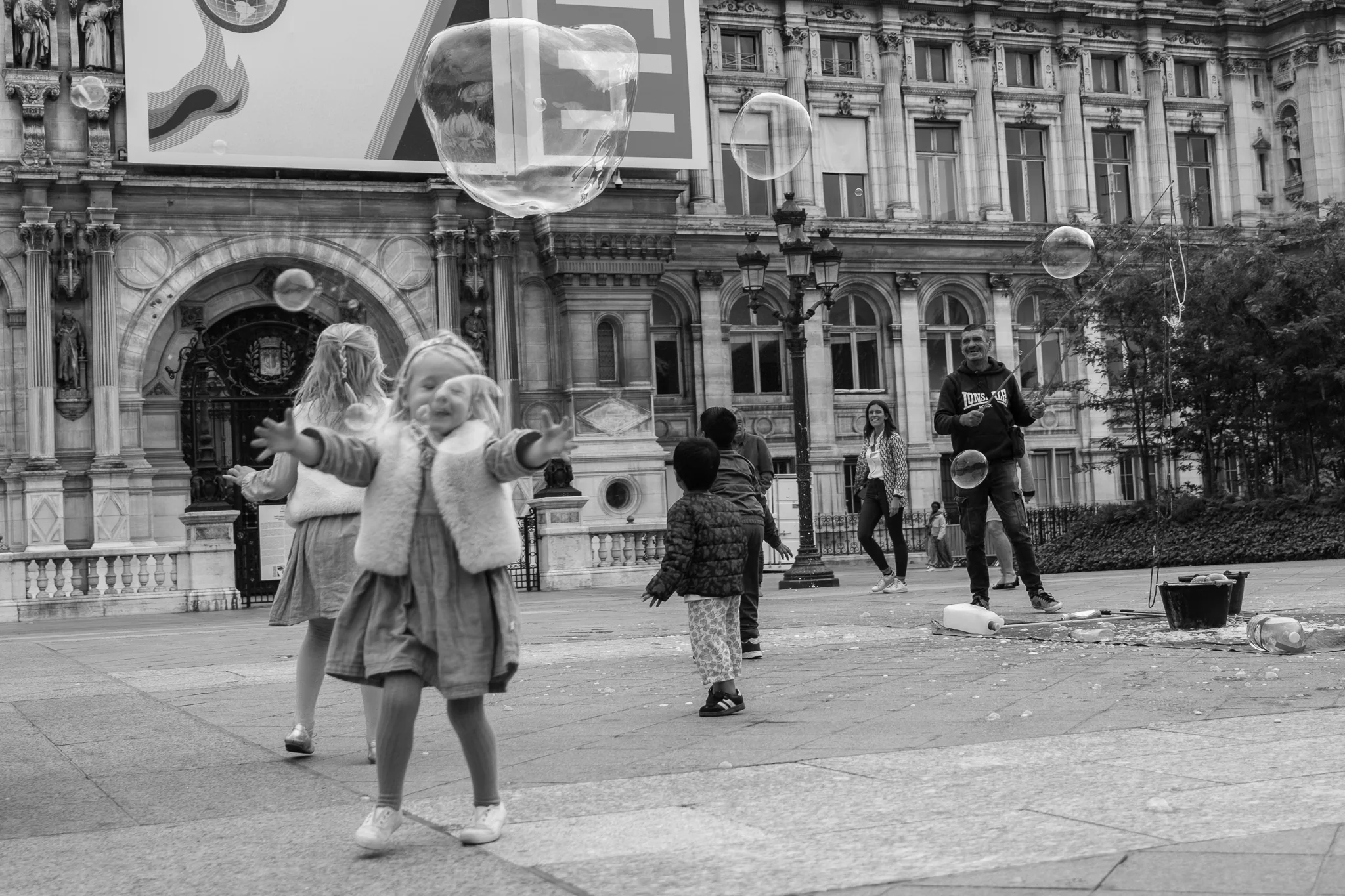 Soap bubbles outside Hôtel de Ville, Paris, photographed by Campbell Jensen