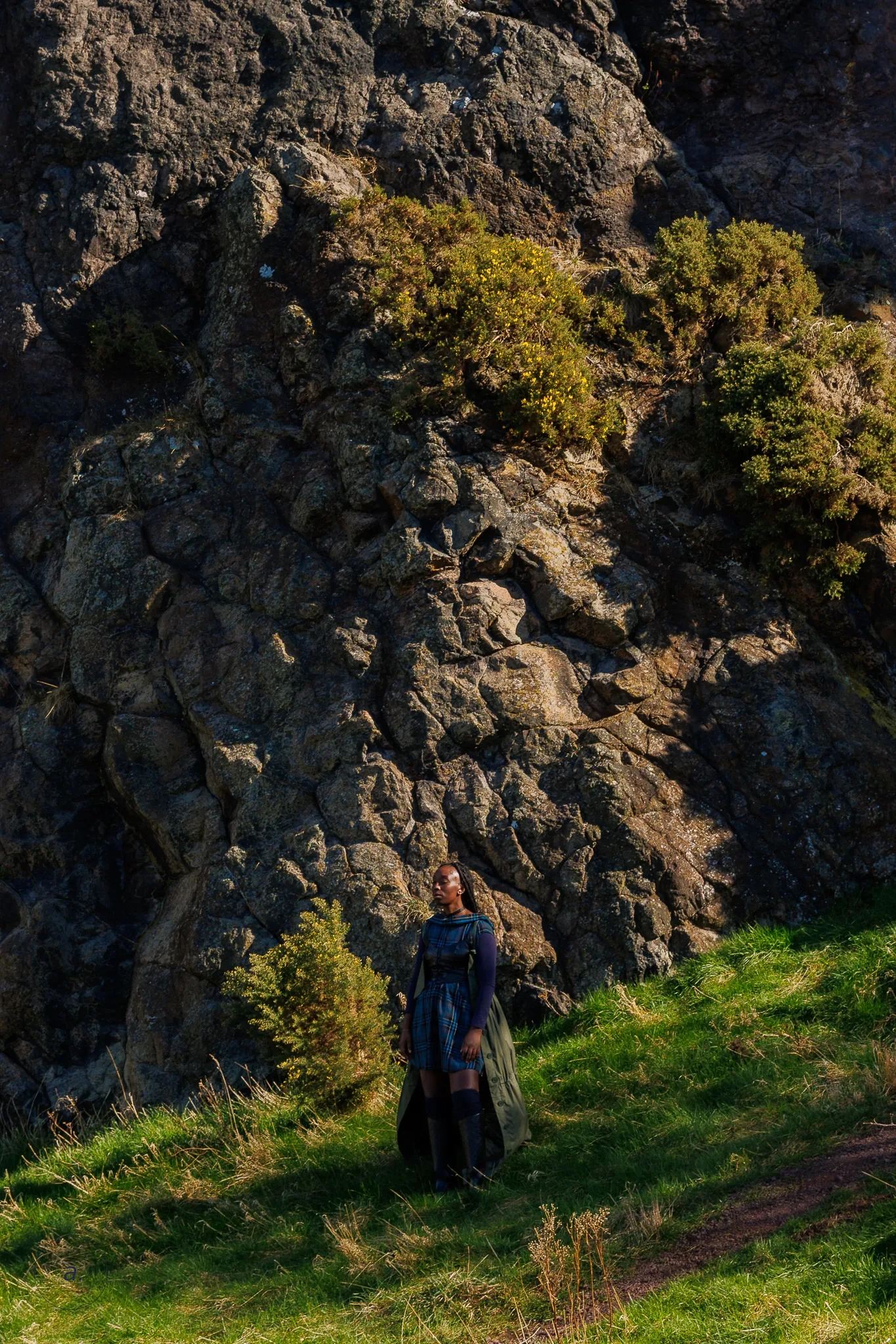 Model in tartan on Arthur's Seat, Edinburgh, photographed by Campbell Jensen