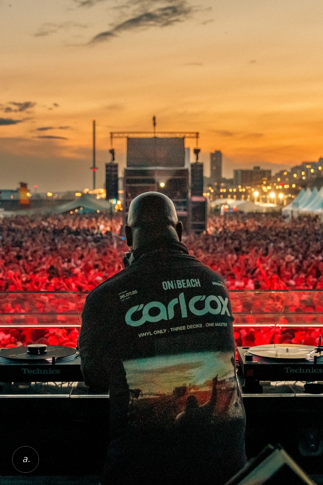 Carl Cox at the decks, sunset, Brighton, photographed by Campbell Jensen