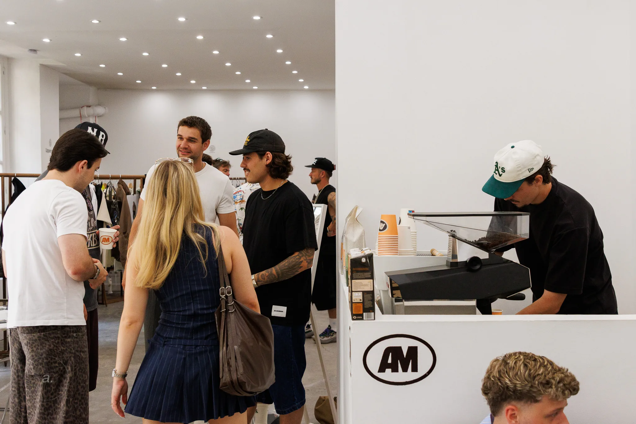 Guests browsing the new season at Good Place Showroom, Paris, photographed by Campbell Jensen