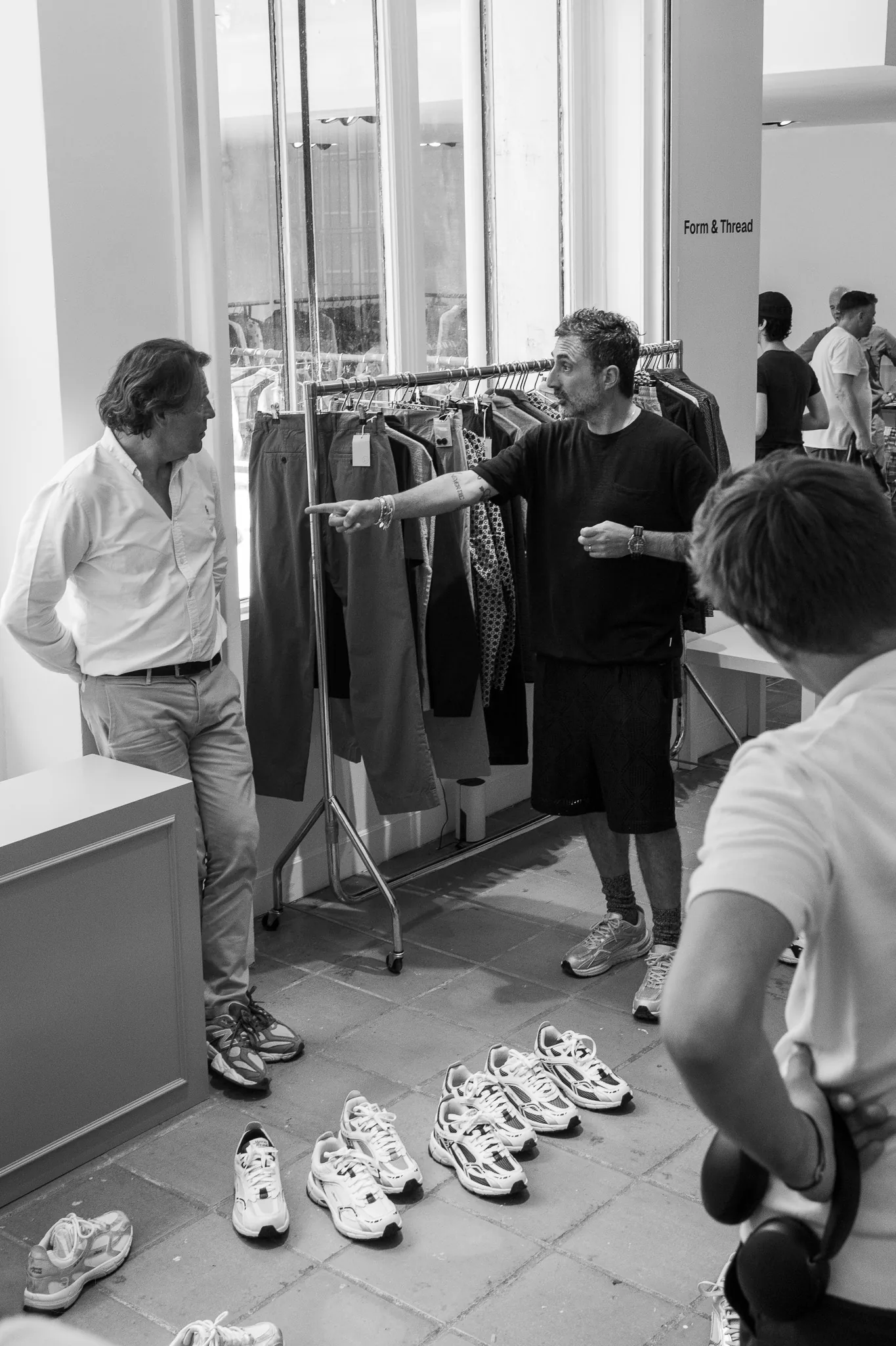 Guests at the rails at Good Place Showroom, Paris, photographed by Campbell Jensen
