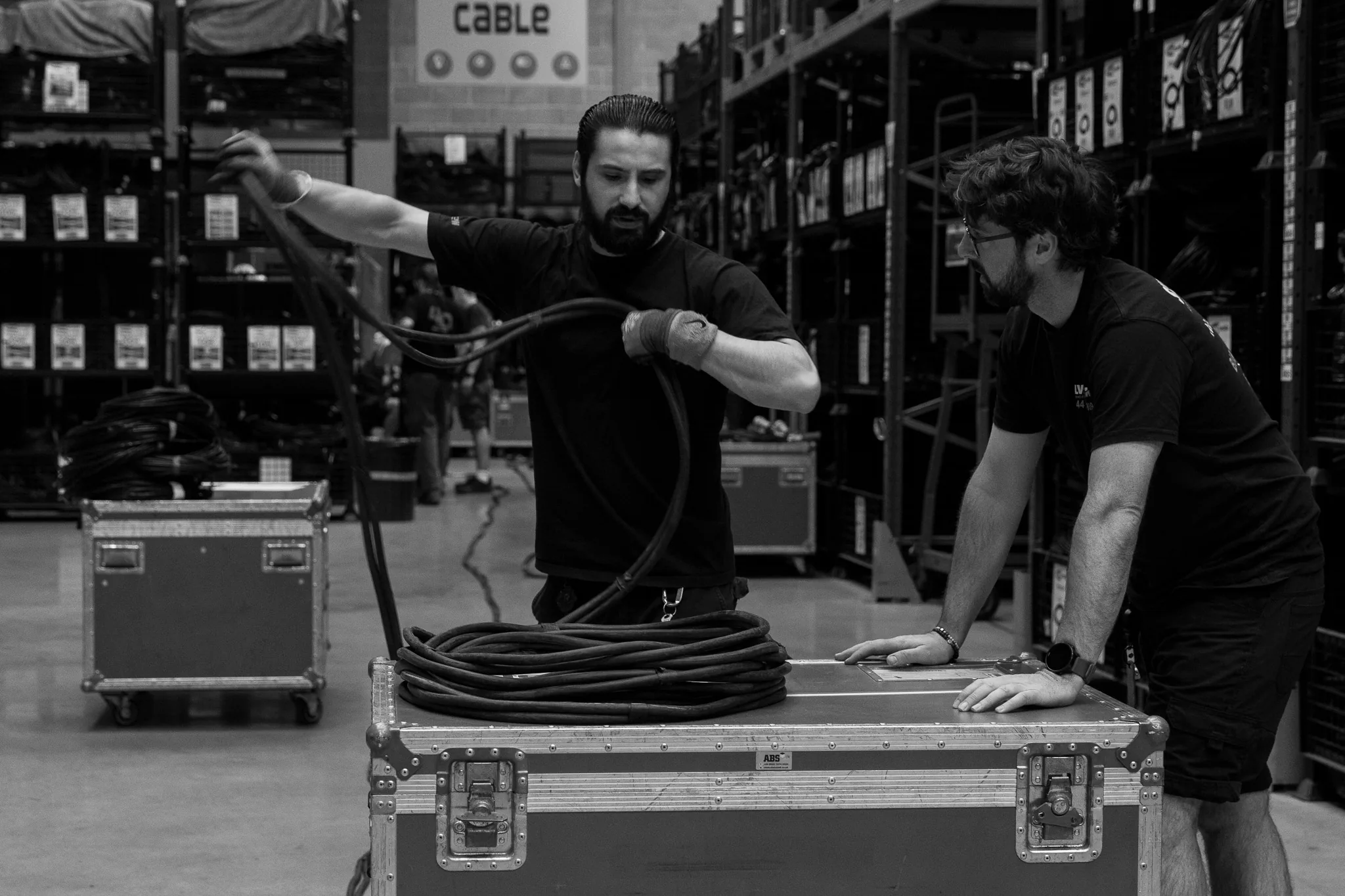 Crew coiling cable by hand, Neg Earth Lights, London, photographed by Campbell Jensen