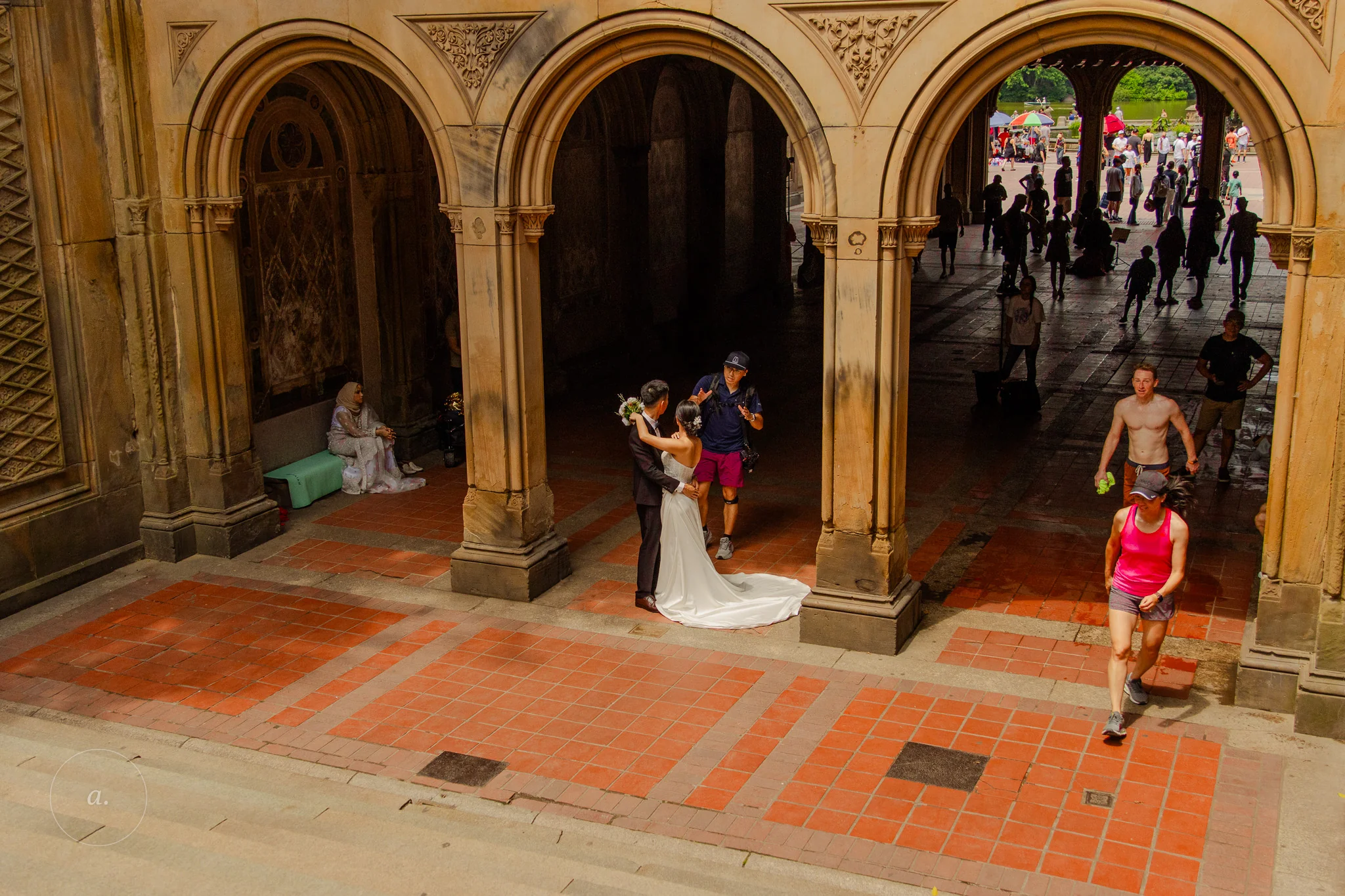 A wedding couple photographed under the arches of Bethesda Terrace, Central Park, by Campbell Jensen