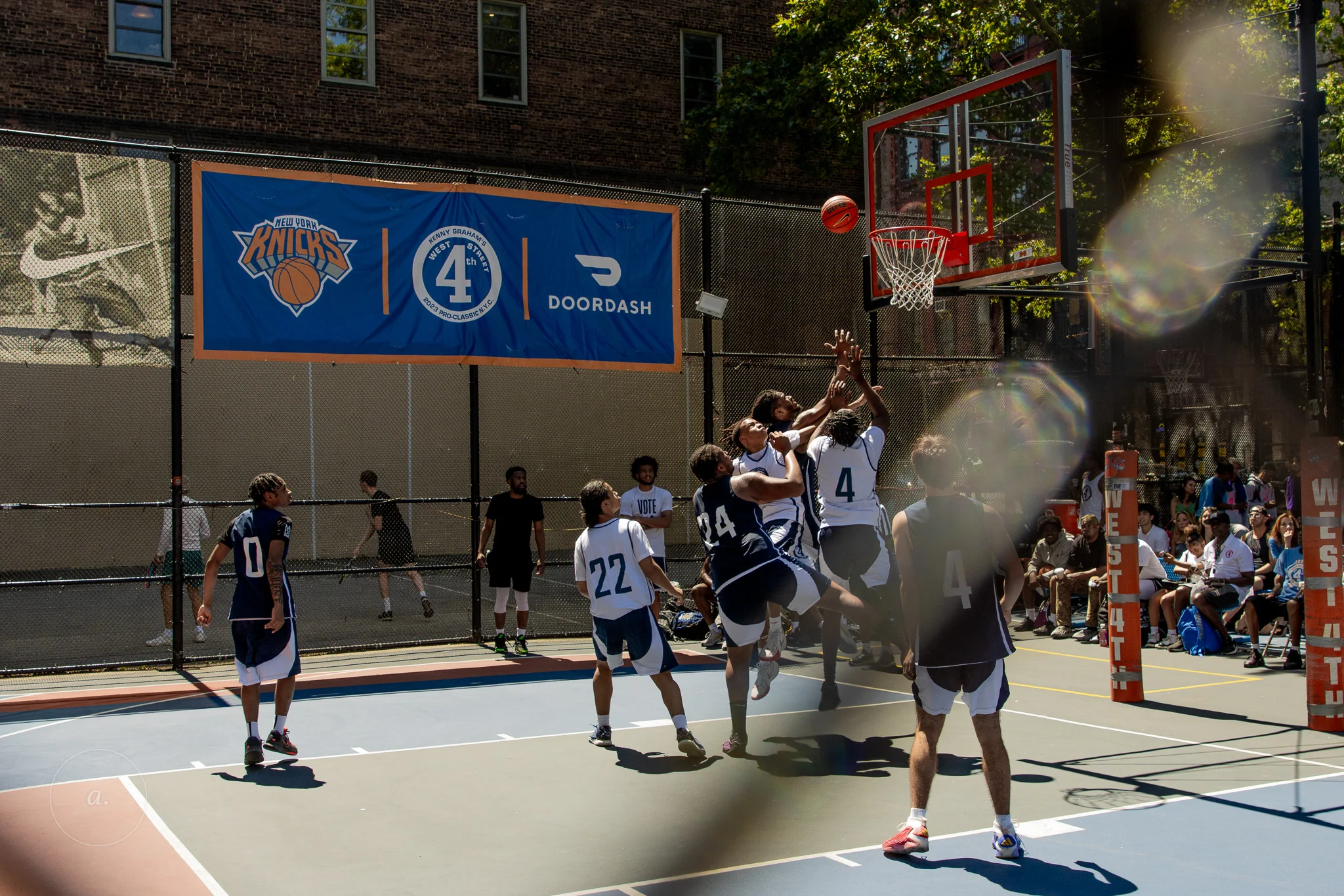 A contested rebound at the West 4th Street basketball courts, New York, photographed by Campbell Jensen