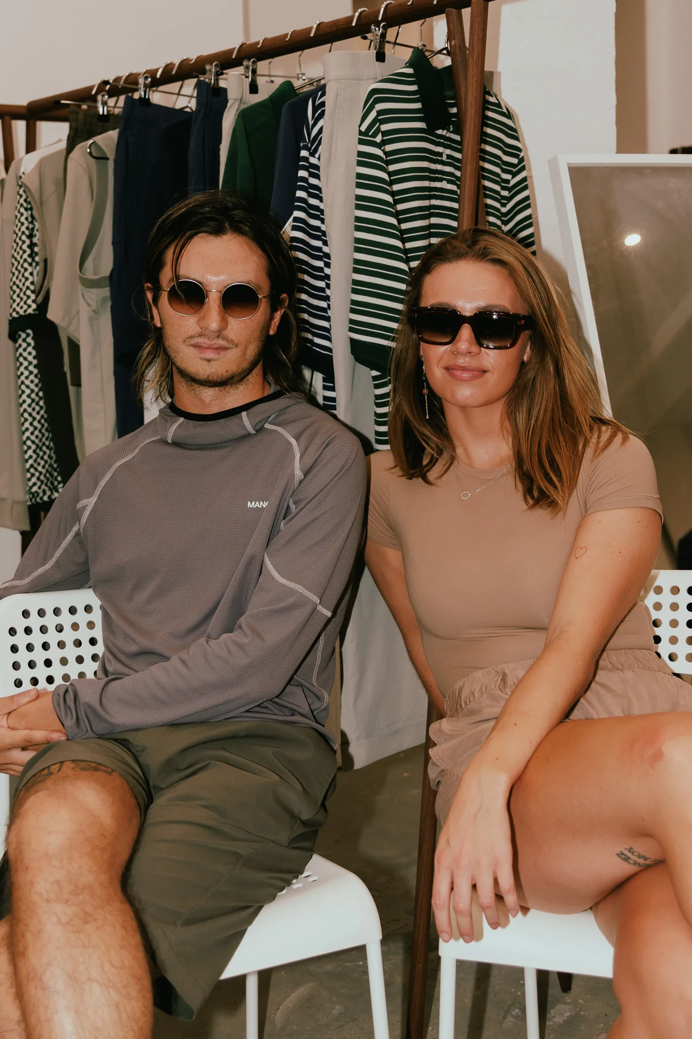 Two guests seated in sunglasses, Waiting for the Sun, Paris, photographed by Campbell Jensen
