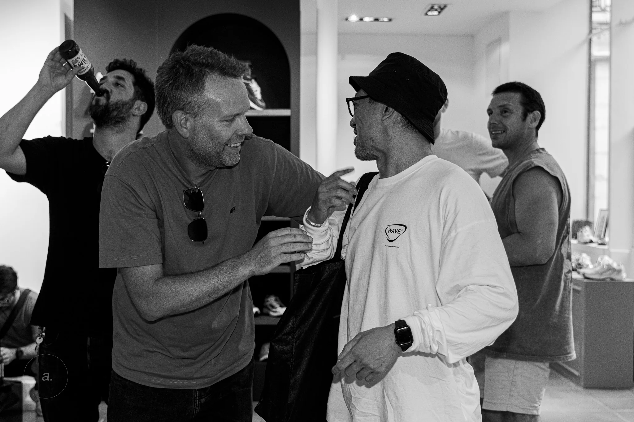 Friends talking at the Waiting for the Sun event, Paris Fashion Week, photographed by Campbell Jensen
